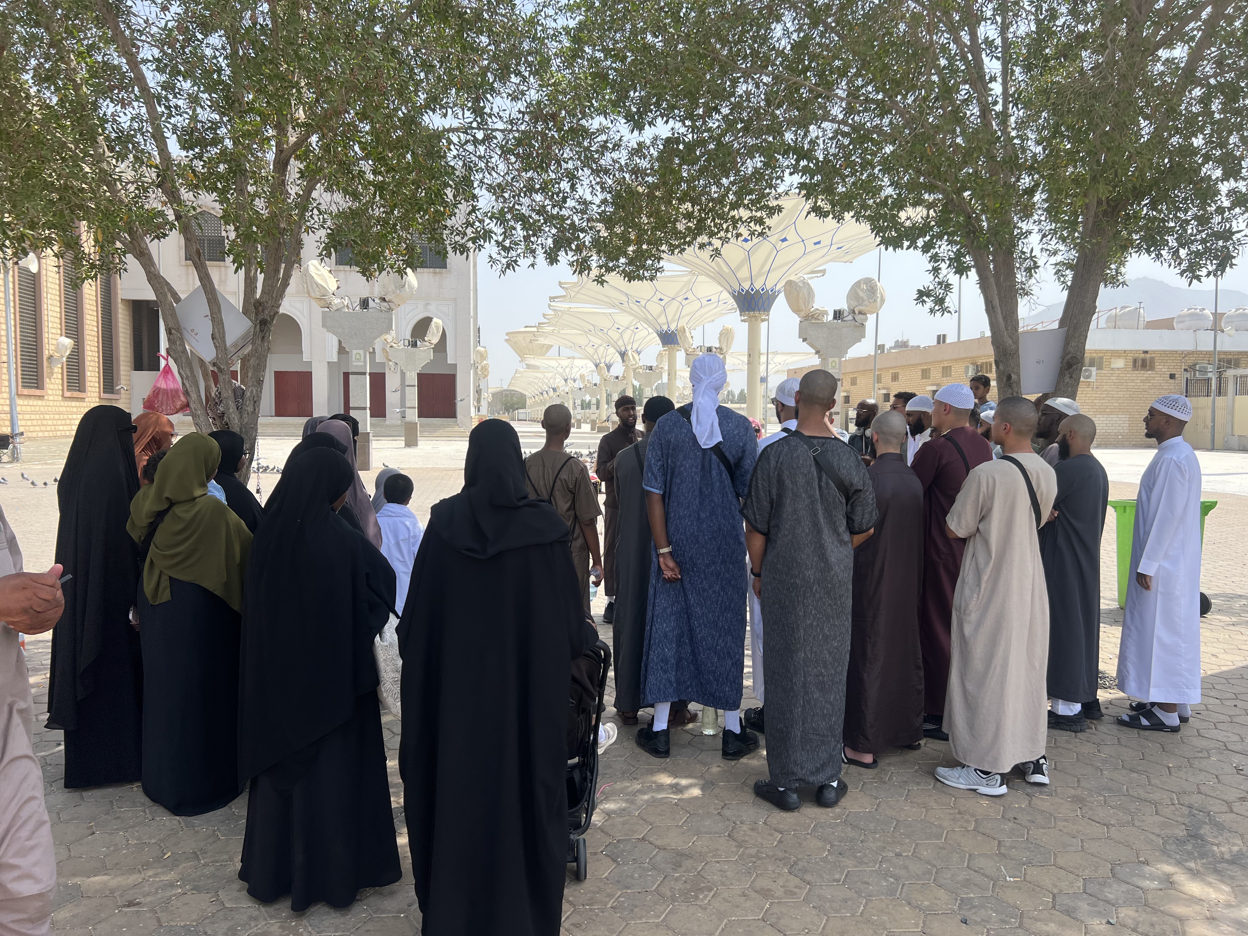 Rawdah Tours travellers gathered beneath the mosque canopies in Madinah