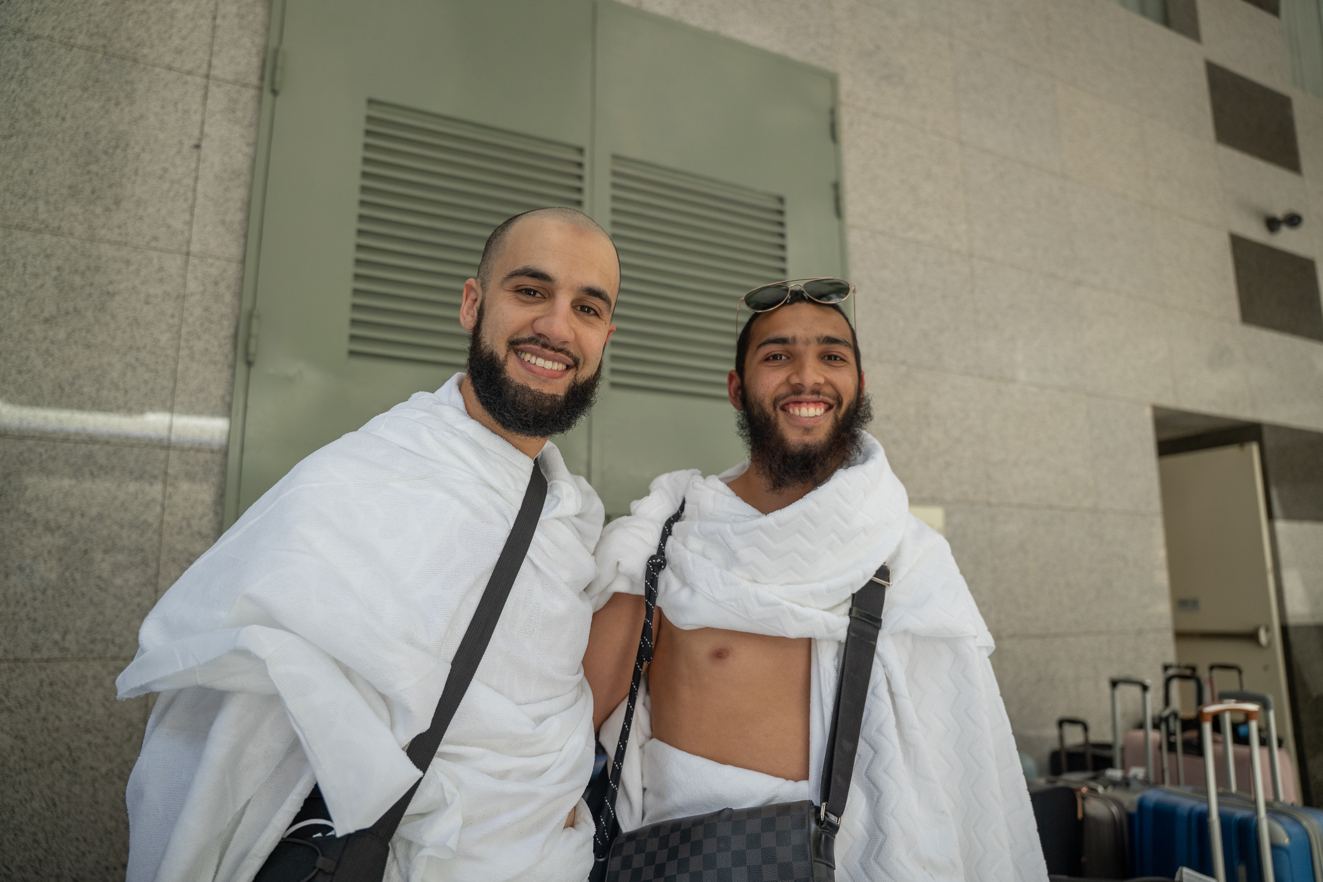 Two Rawdah Tours travellers standing together in ihram