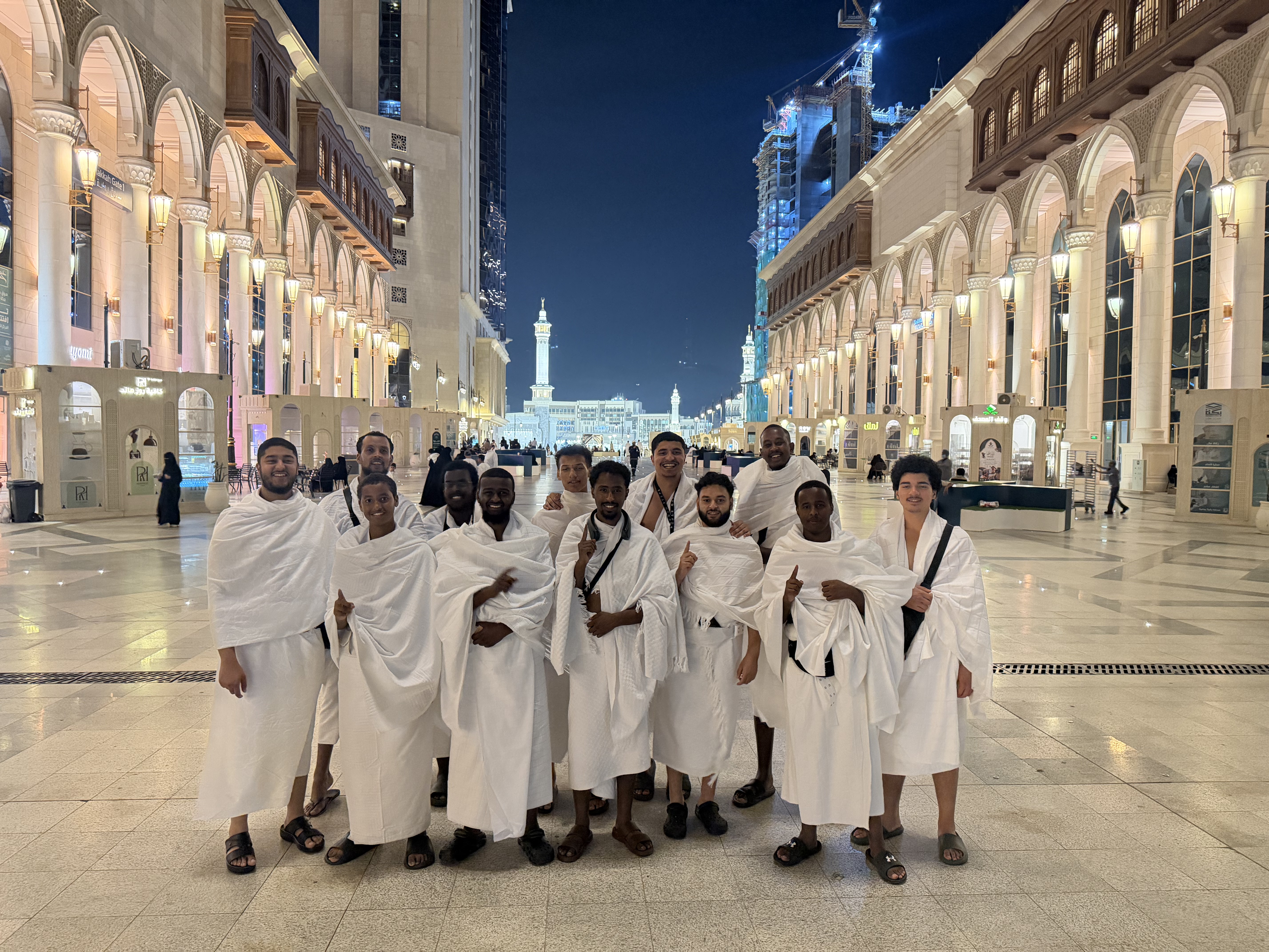 Rawdah Tours travellers gathered outside Masjid al-Haram at night