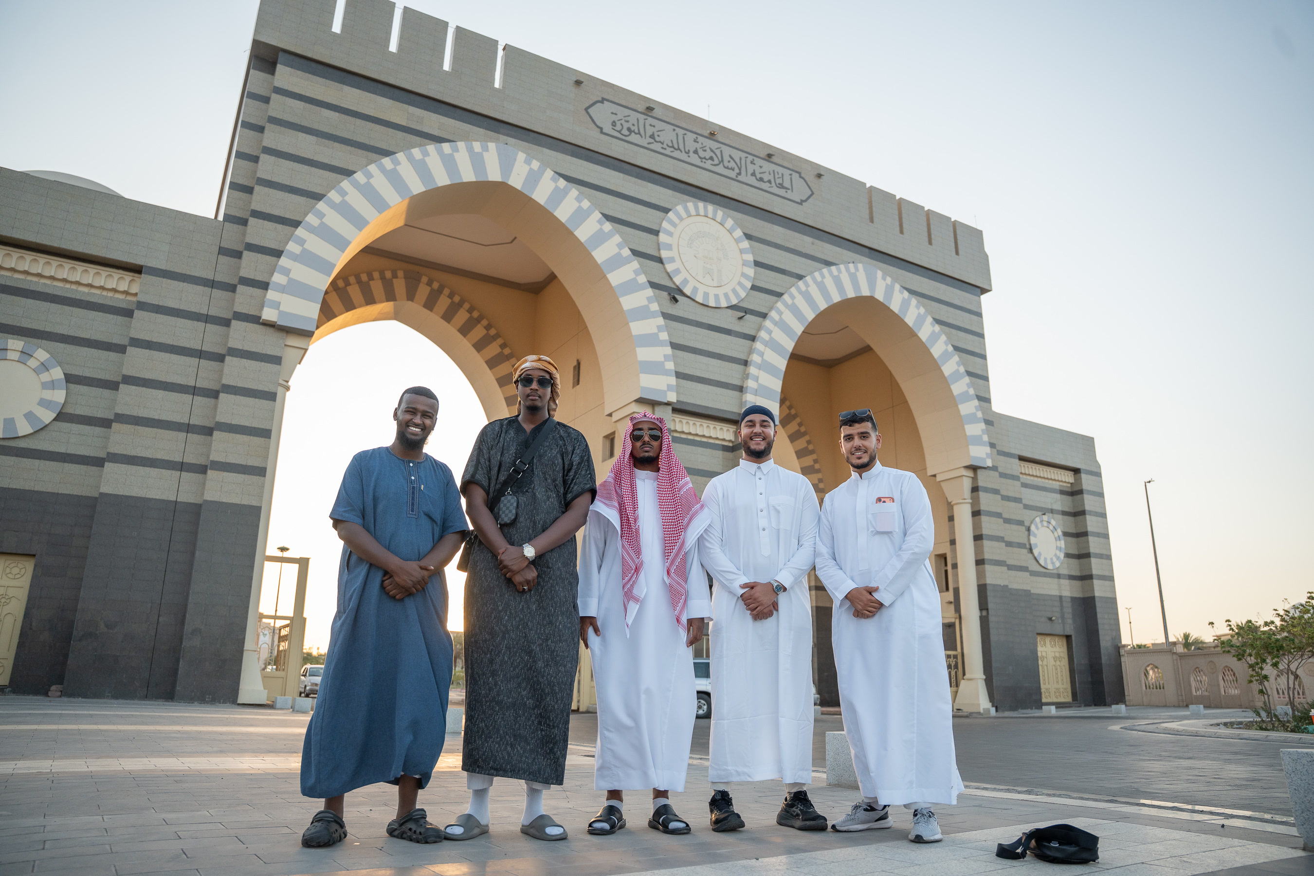 Rawdah Tours travellers gathered outside the Islamic University of Madinah